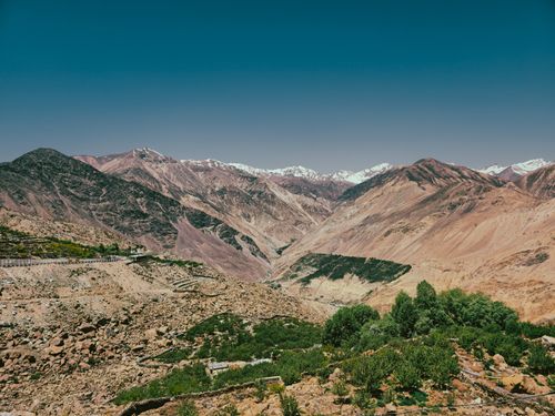 Free Stunning view of the Himalayan mountains with clear skies, showcasing the rugged terrain and lush greenery. Stock Photo