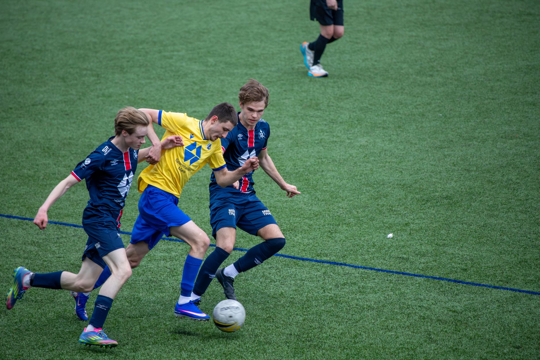 Action-packed soccer game with players competing fiercely on a verdant field.