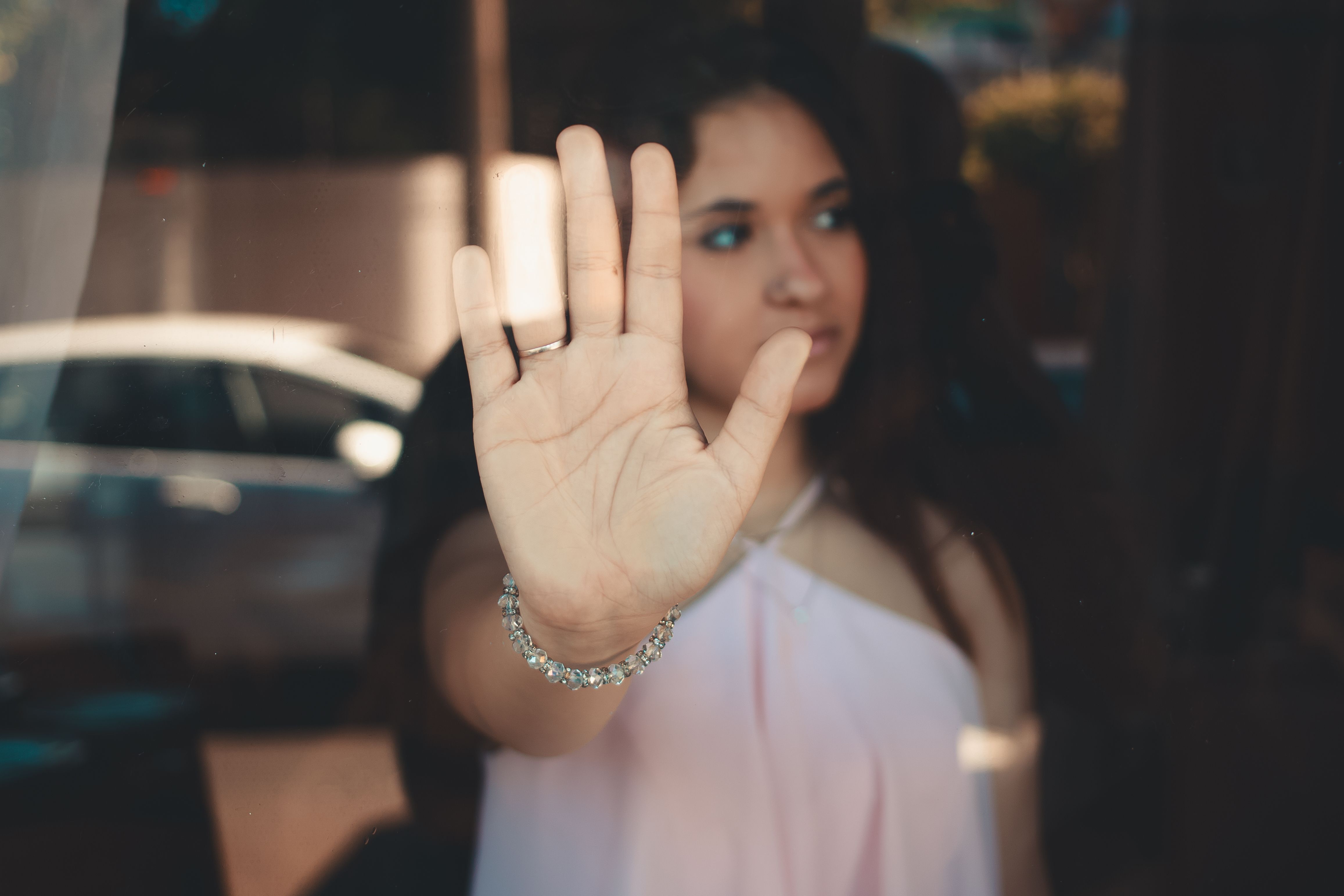 Woman Pressing Hand Against Glass in Reflection · Free Stock Photo