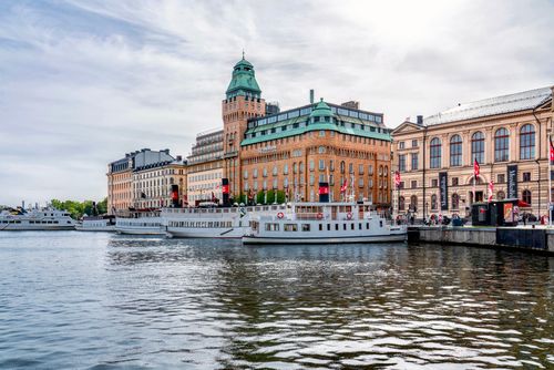 Free Historical waterfront of Stockholm with classic architecture and charming boats Stock Photo