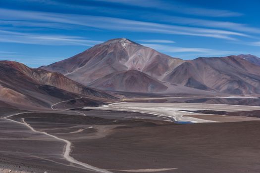 Breathtaking view of the Andes Mountains in Catamarca, Argentina, showcasing rugged terrain and clear blue skies.