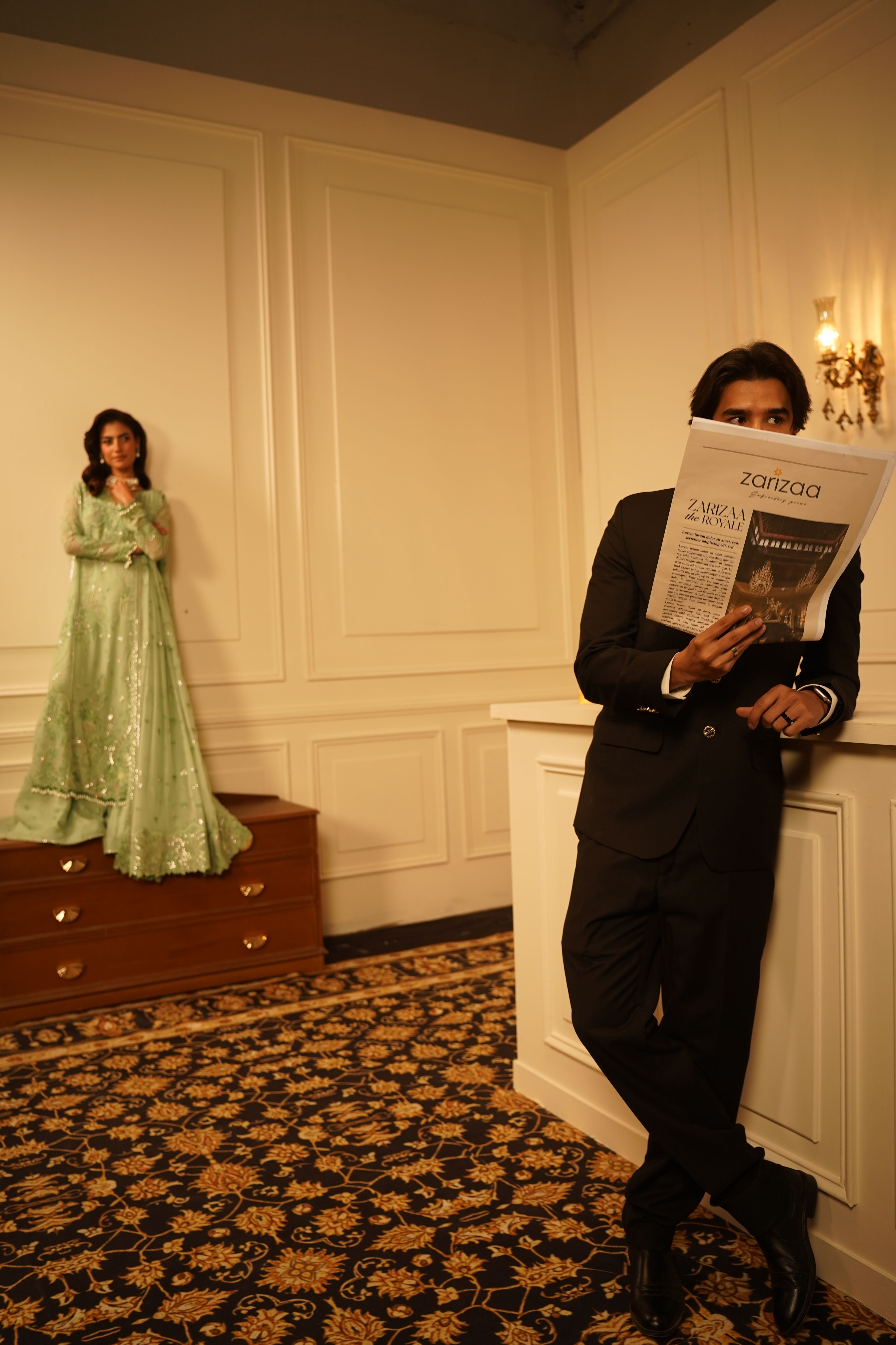 Stylish indoor fashion portrait featuring models and vintage decor.