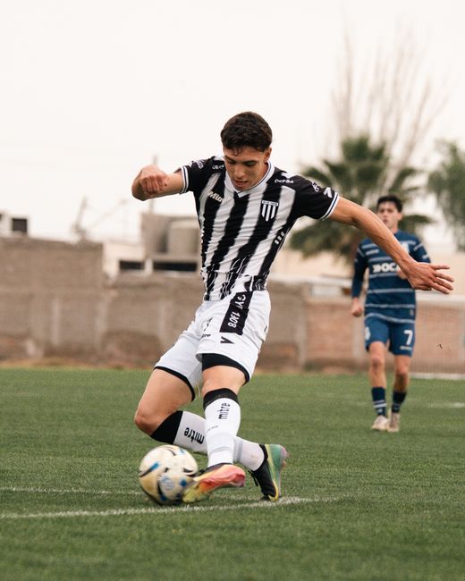 football player striking ball goal