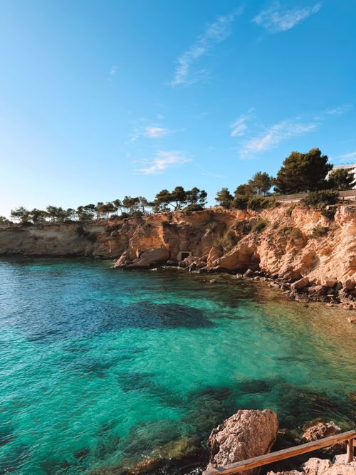 Free Stunning Mediterranean coast with clear blue waters and rocky cliffs under bright skies. Stock Photo