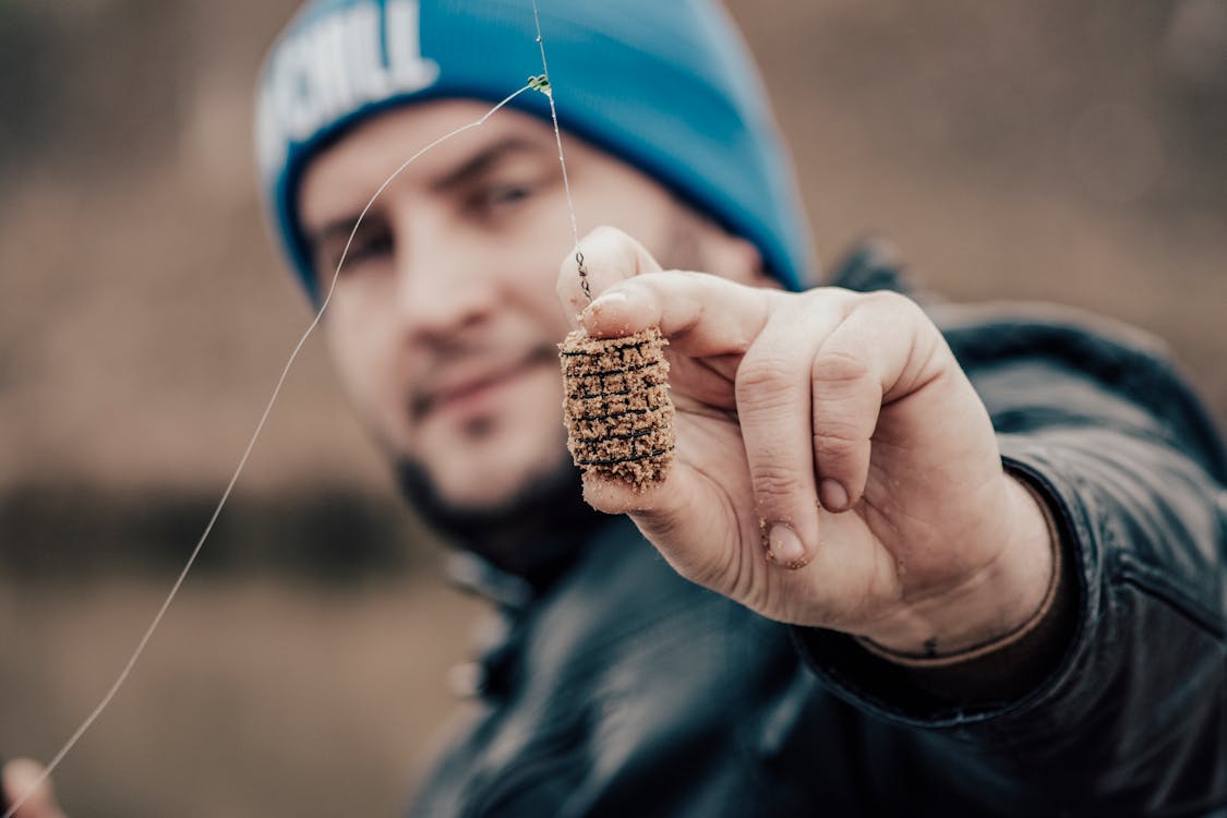 Person Holding Fishing Bait