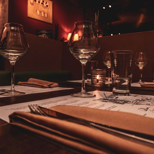 Restaurant table with glasses at night