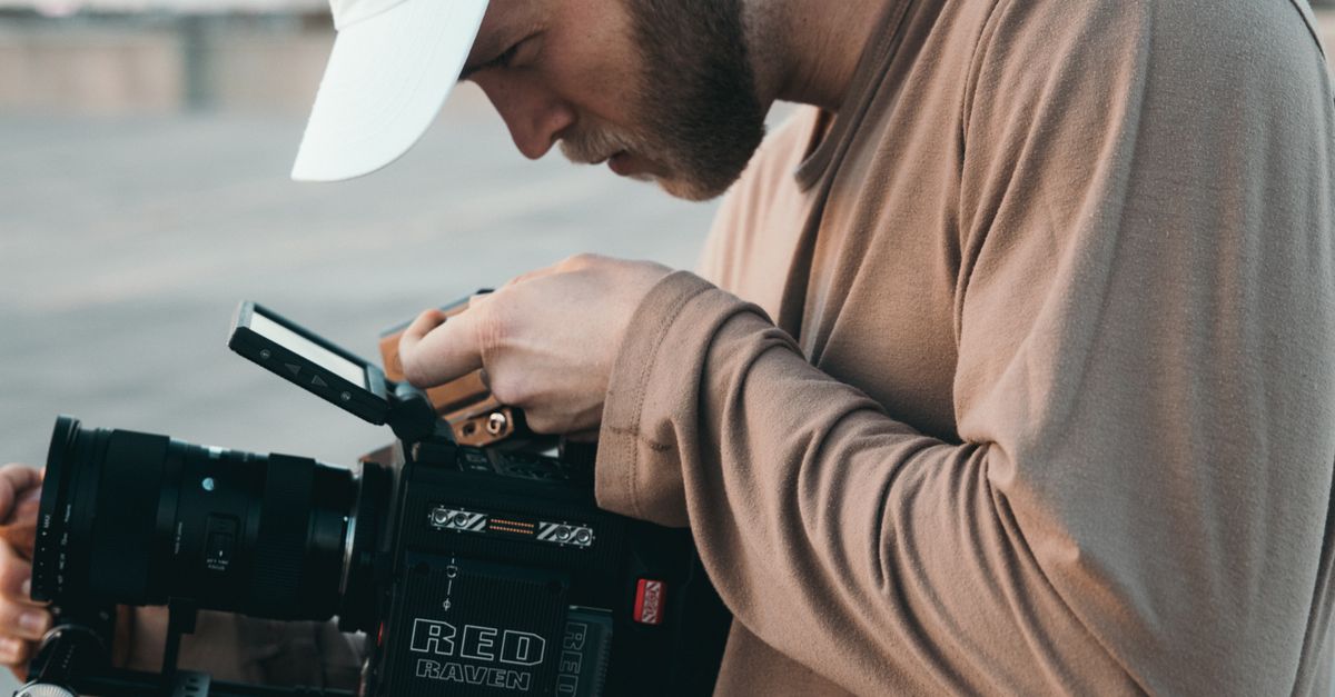 Camera Man Use Video Camera A Man using a Video Camera · Free Stock Photo