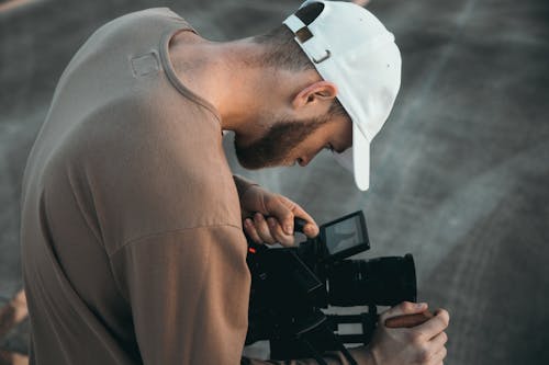 A Man using a Videocamera