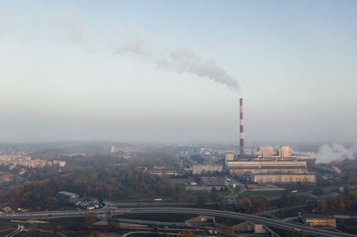 Free Aerial shot of a power plant emitting smoke, highlighting urban air pollution and industrial impact. Stock Photo
