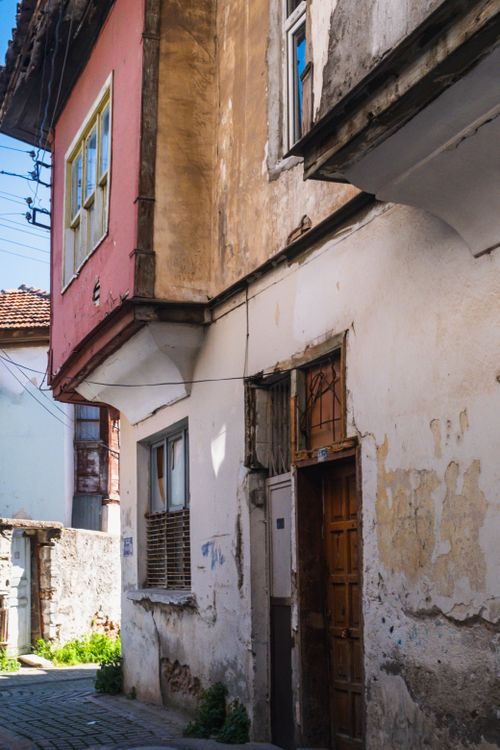 Free Charming rustic architecture on a sunlit Mediterranean street corner. Stock Photo
