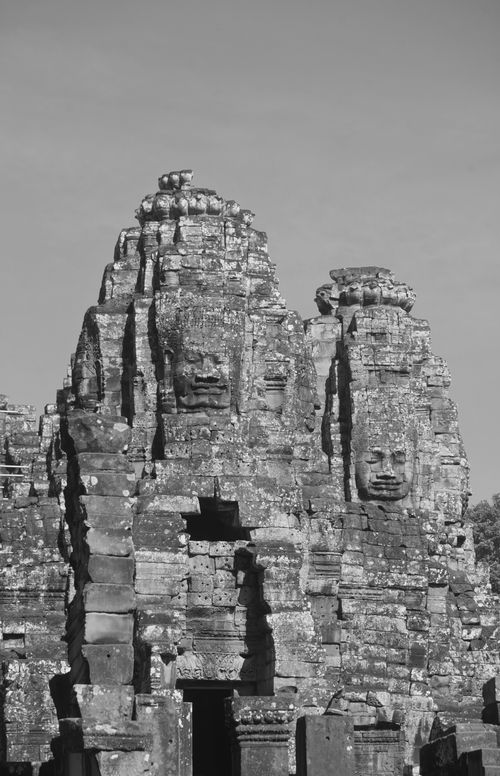 Free Black and white photo of Bayon Temple with iconic smiling faces, Angkor, Cambodia. Stock Photo