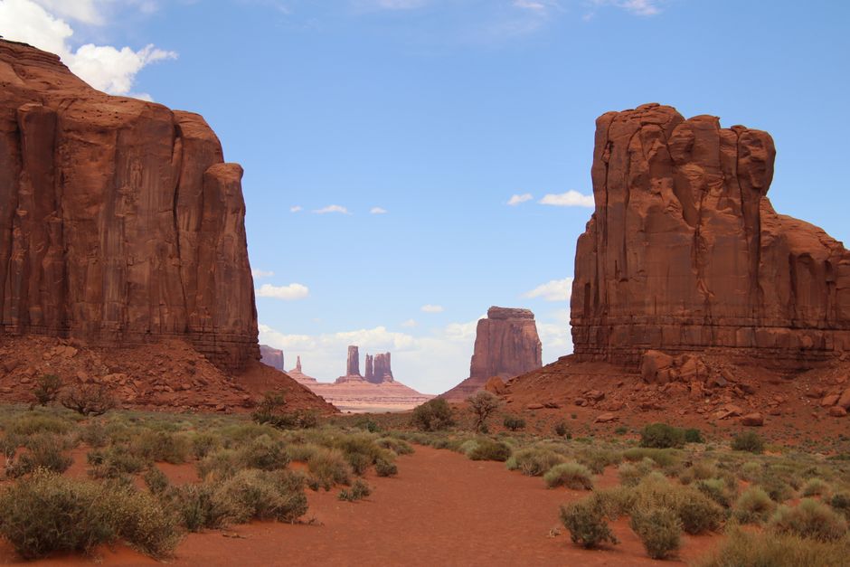 Beautiful landscape of Monument Valley with iconic red rock formations under a clear blue sky.