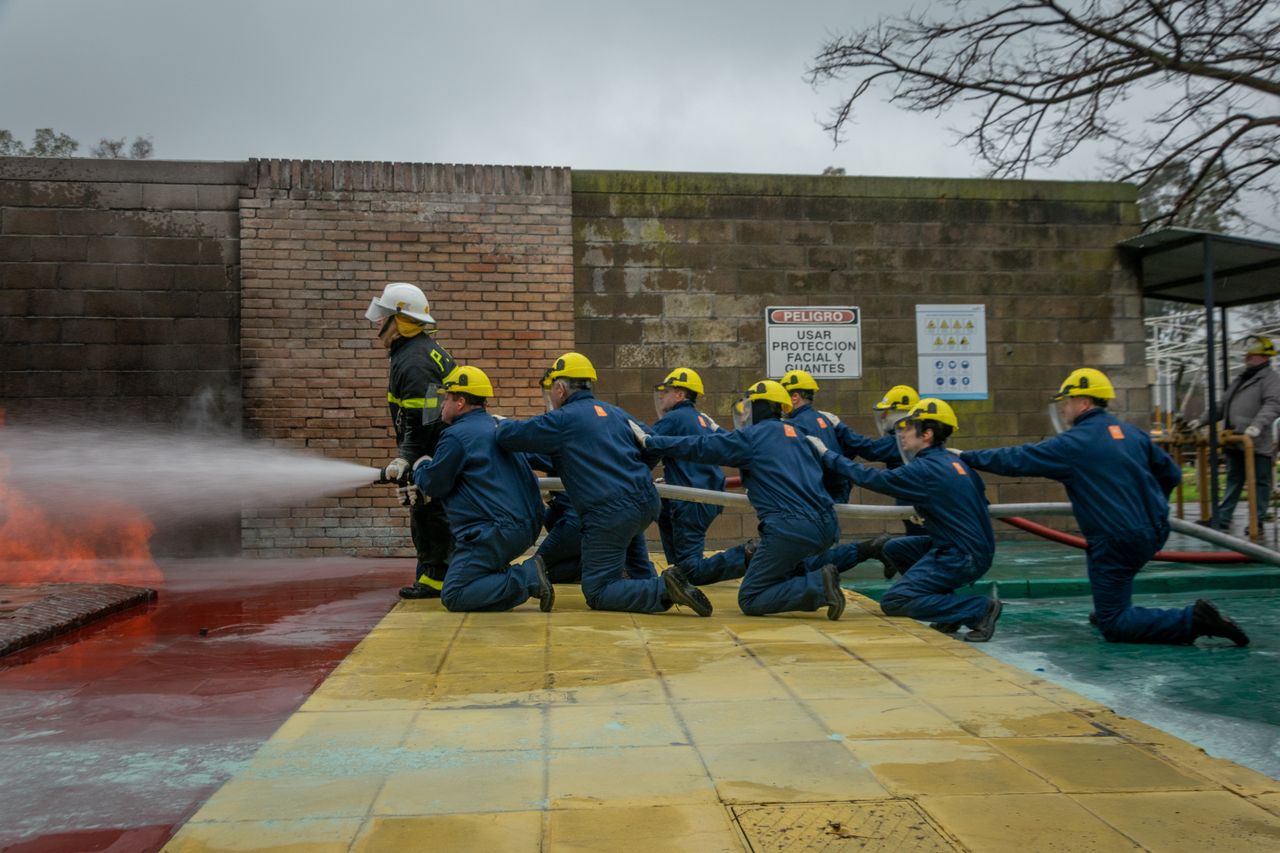Firefighters practicing hose handling