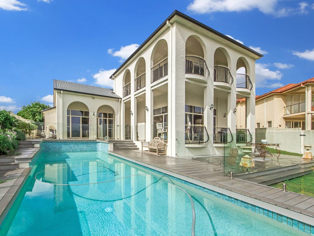 White Concrete Building Near Swimming Pool