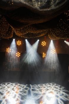 A vibrant display of stage lights at an indoor event, creating a captivating atmosphere.