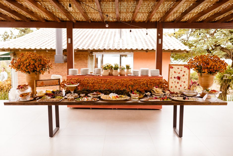 Elegant wedding buffet table display with assorted charcuterie, breads, and appetizers`