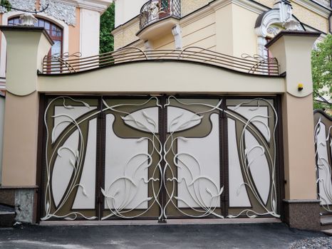 Elegant Art Nouveau gate with intricate floral design in a city architecture setting.. pexels, elegant, nouveau