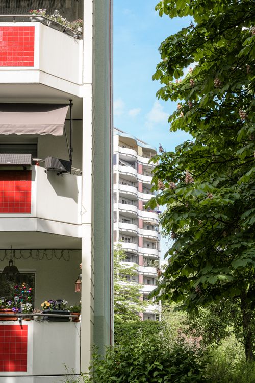 Free Urban apartment buildings with trees in Berlin on a bright day. Stock Photo