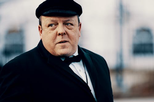 Man in Black Suit Jacket Wearing Black Beret