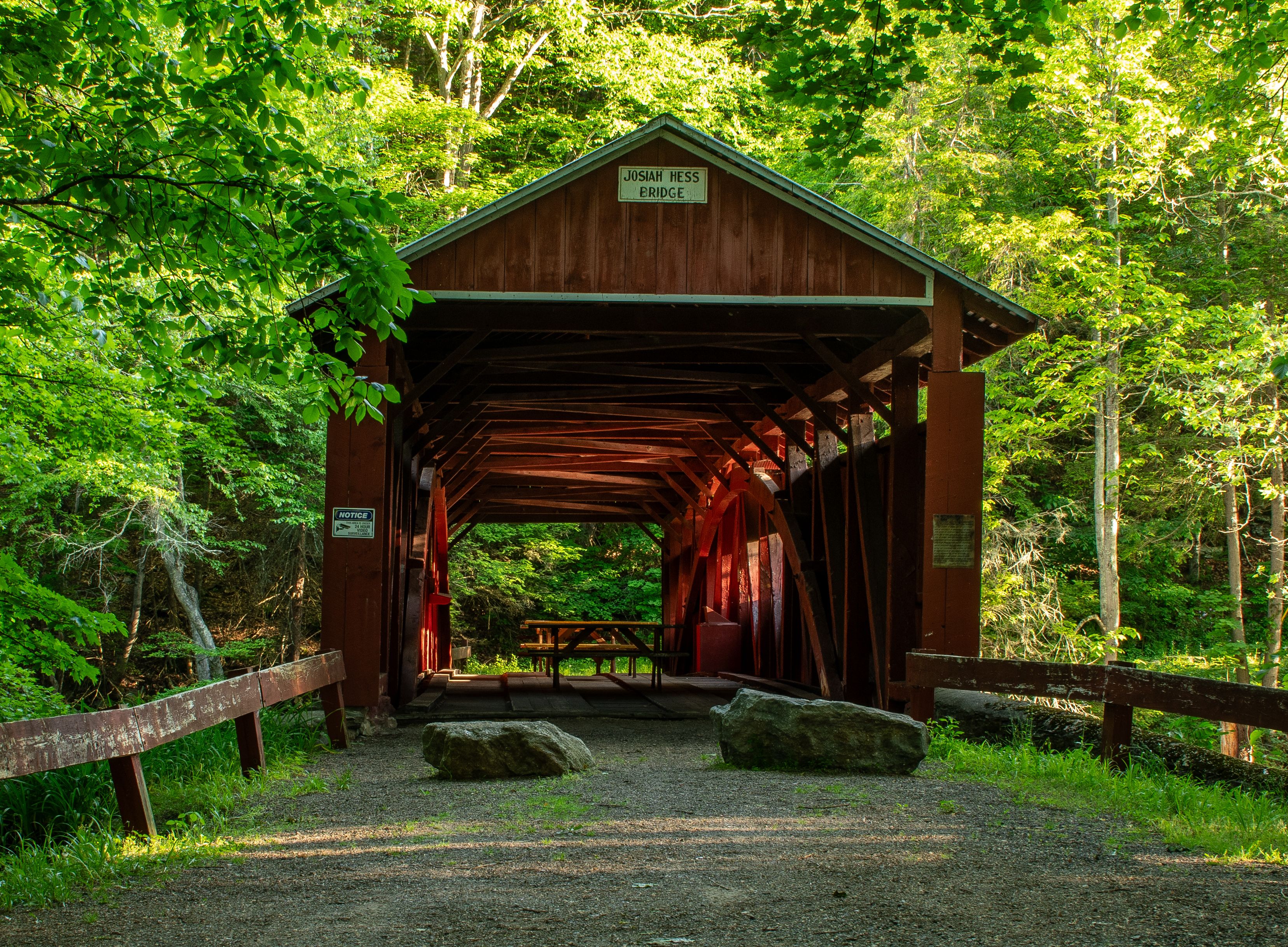 Vintage Red Covered Bridge in Spring Forest · Free Stock Photo