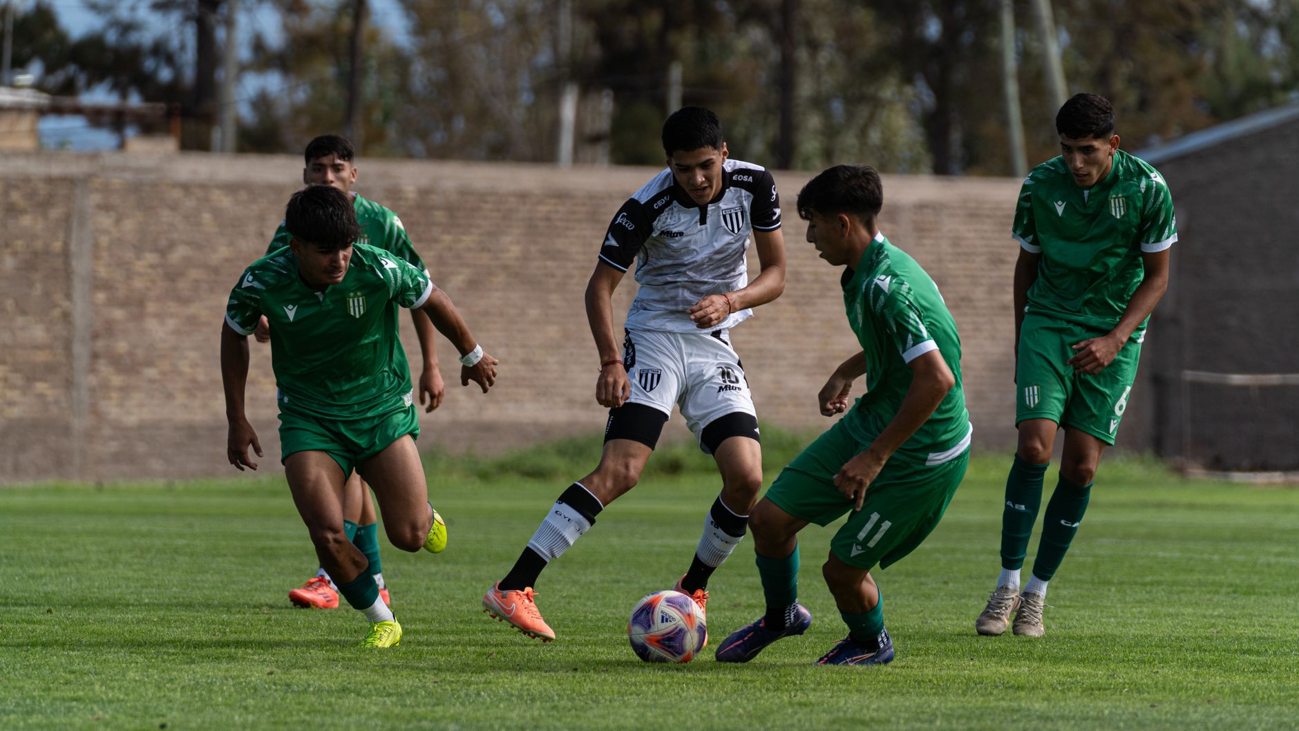 Uzbekistani defenders regrouping after conceding, with the scoreboard showing a decisive five-goal Portugal lead