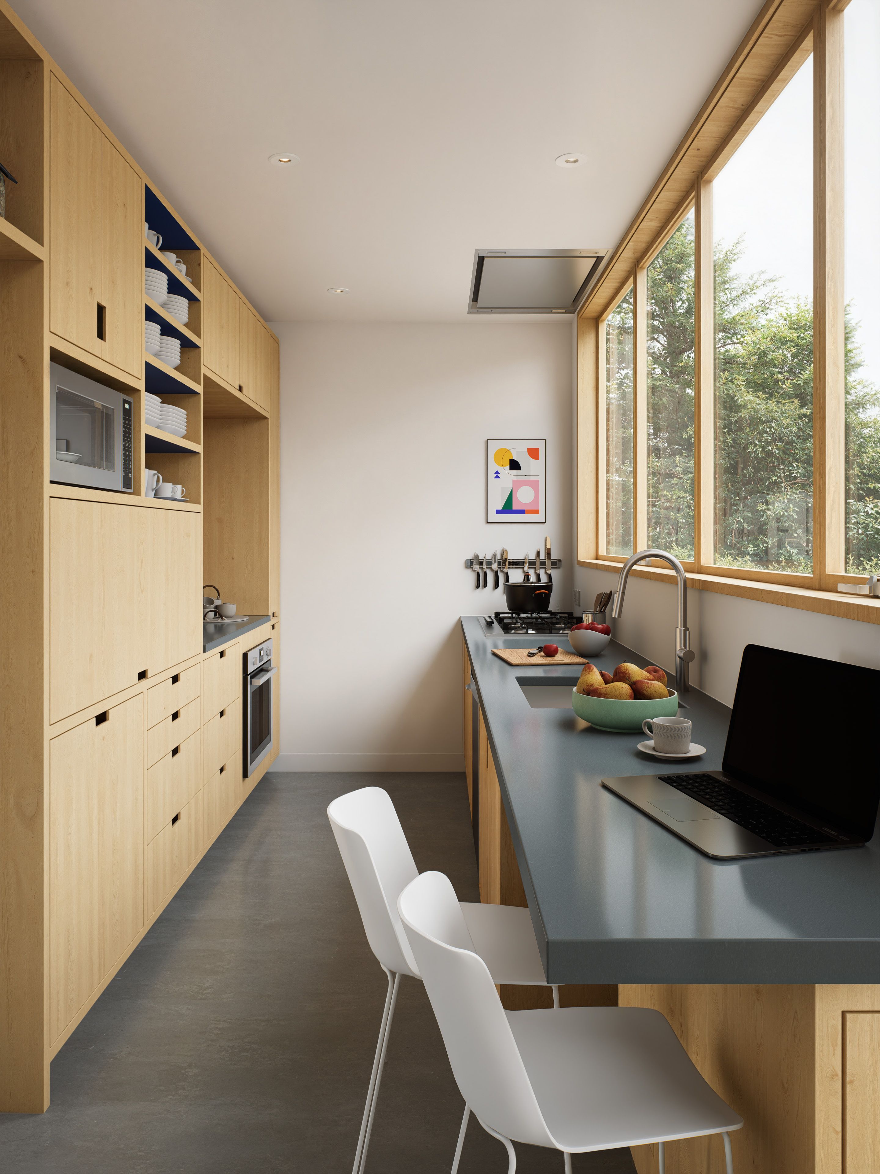 Sleek modern kitchen featuring light wooden cabinetry and large windows providing natural light.