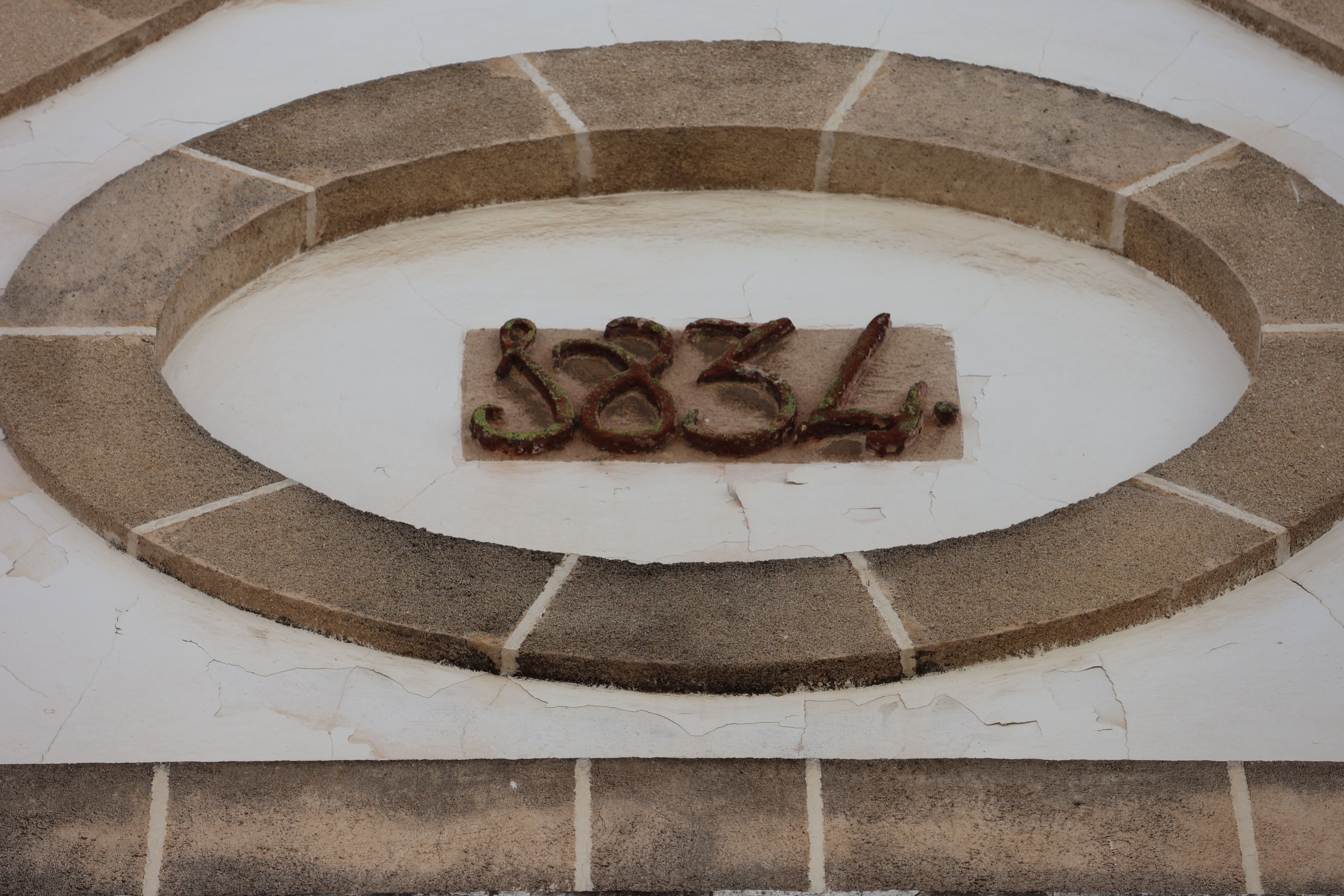 Detail of 1834 architectural feature in El Puerto de Santa María, Spain.