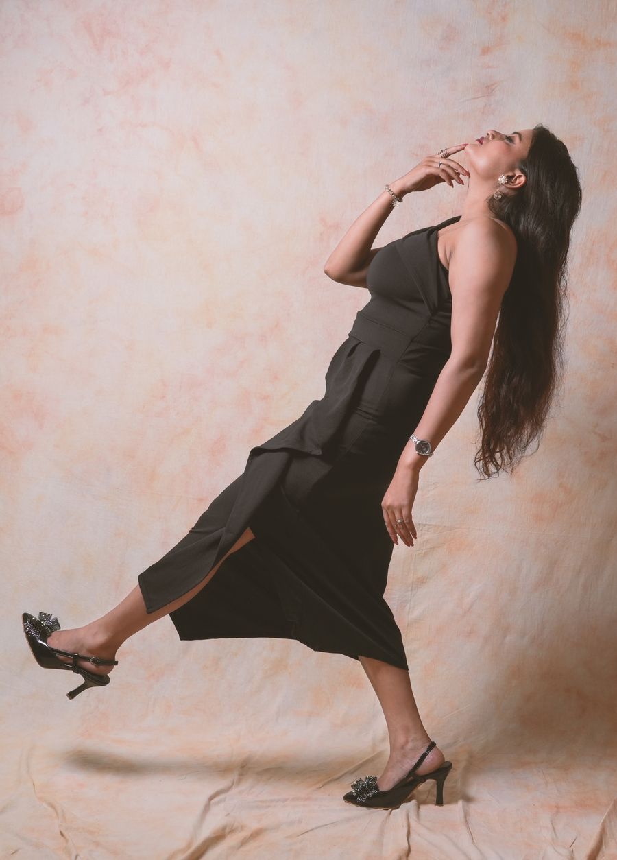 Classy contemporary fashion model in a black dress