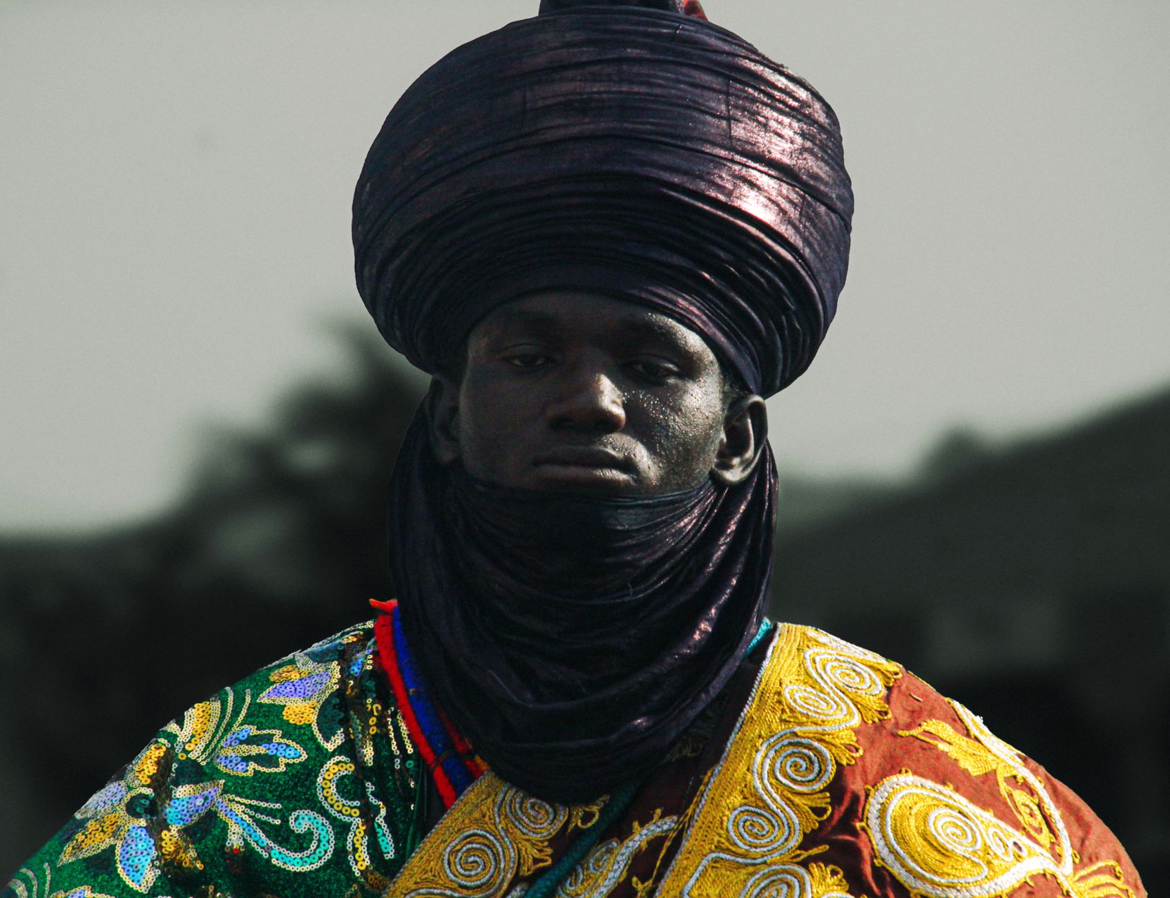 Portrait of a man in traditional Nigerian attire, showcasing cultural heritage in Kaduna, Nigeria.