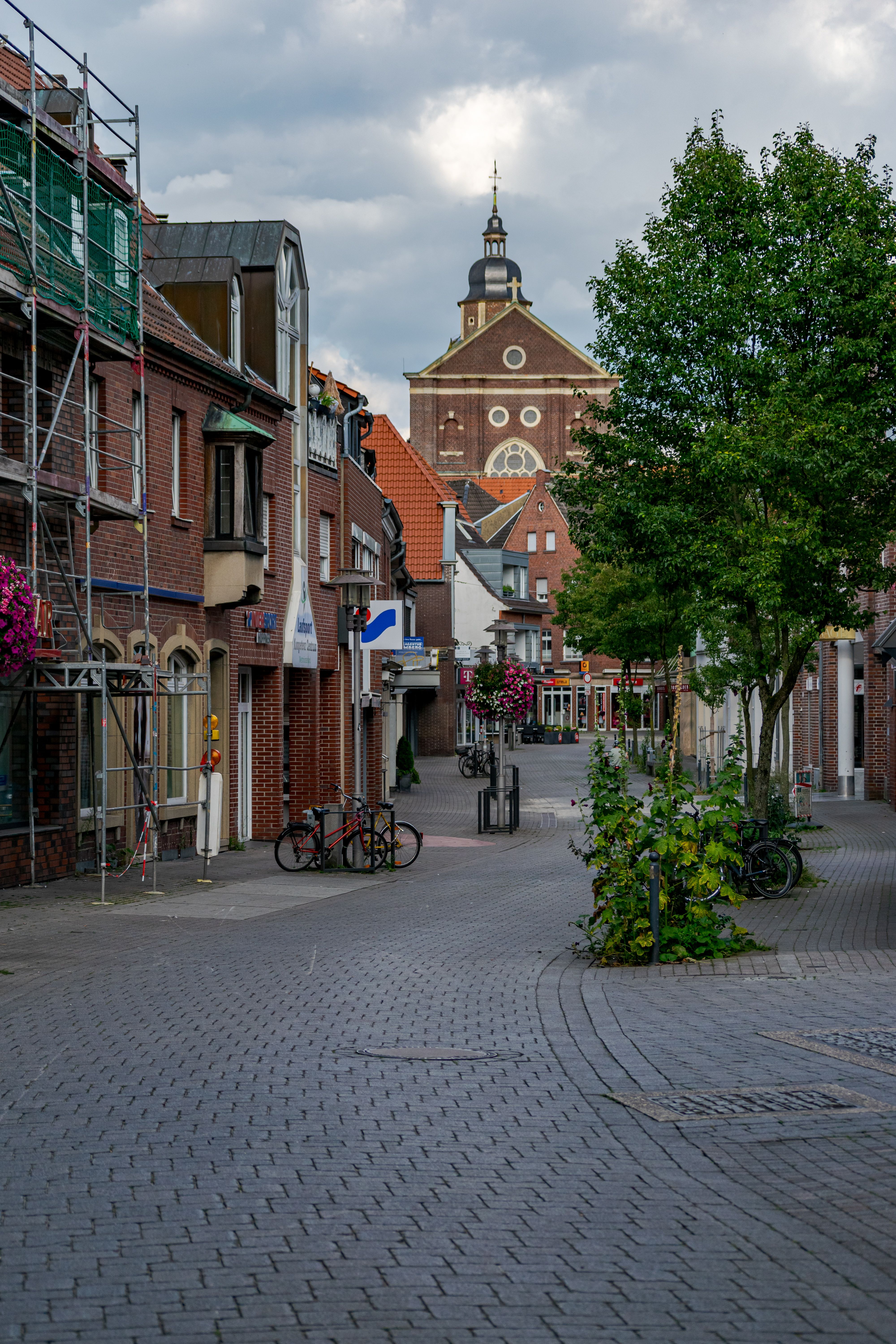 Beautiful street view in Coesfeld, Germany showcasing historic architecture and vibrant street life.