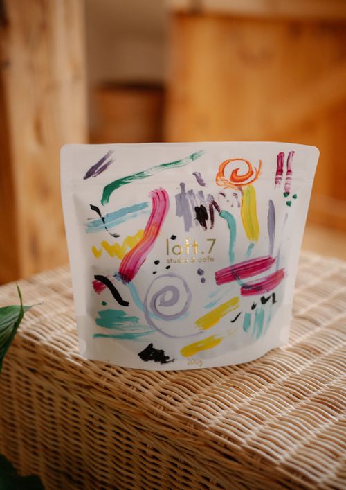 Free Colorful abstract bag on a wicker surface, showcasing creative pattern and design. Stock Photo