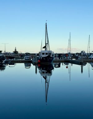 Sailboat masts at a quiet marina, photo by Joolsmagools on Pexels
