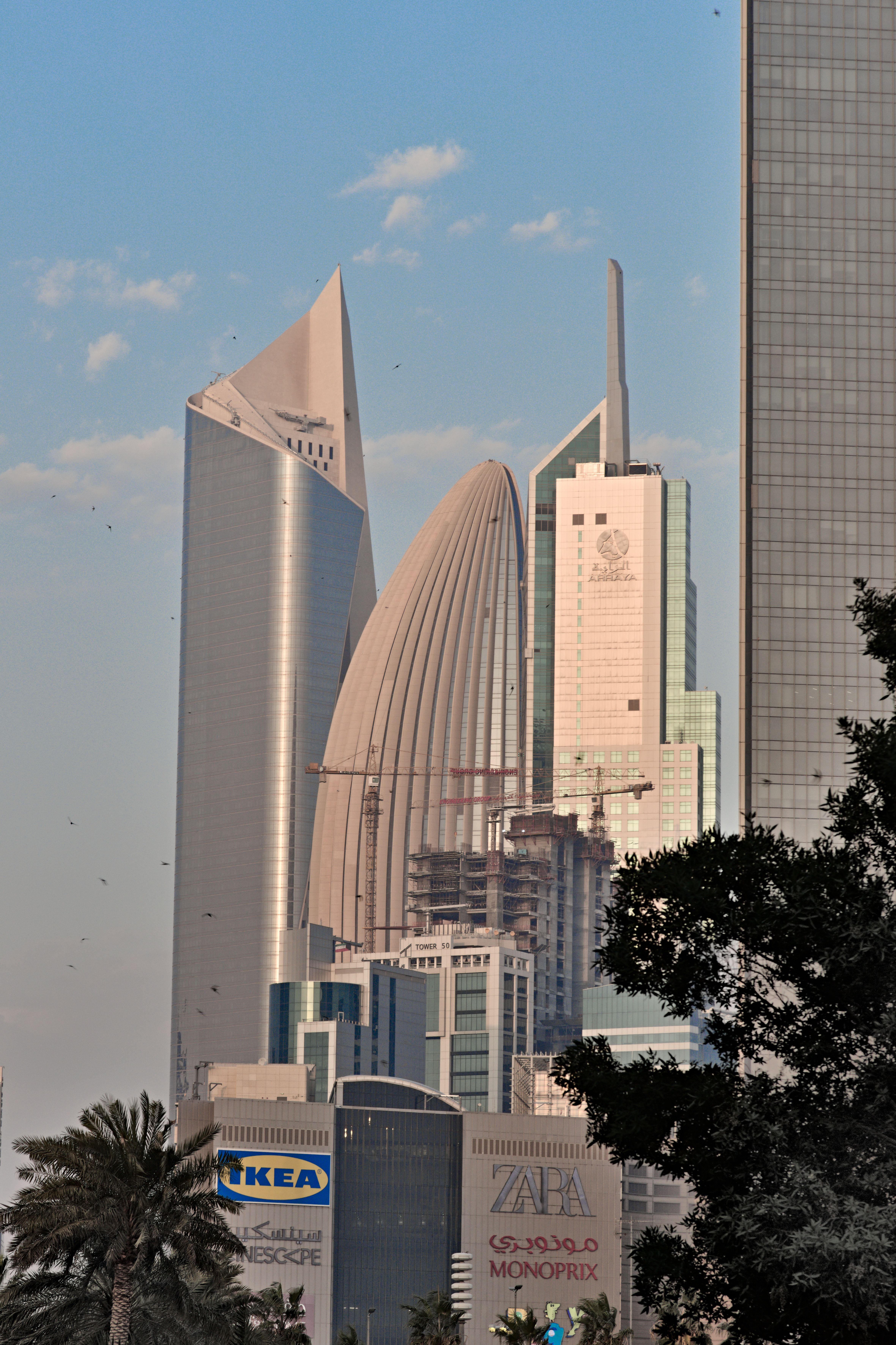 Skyscrapers in Kuwait City showcasing modern architecture with clear sky backdrop.