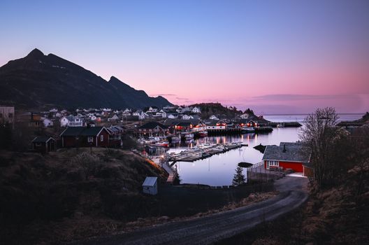 Scenic view of a Nordic fjord village at twilight, capturing the serene beauty of Comté de Nordland, Norway.