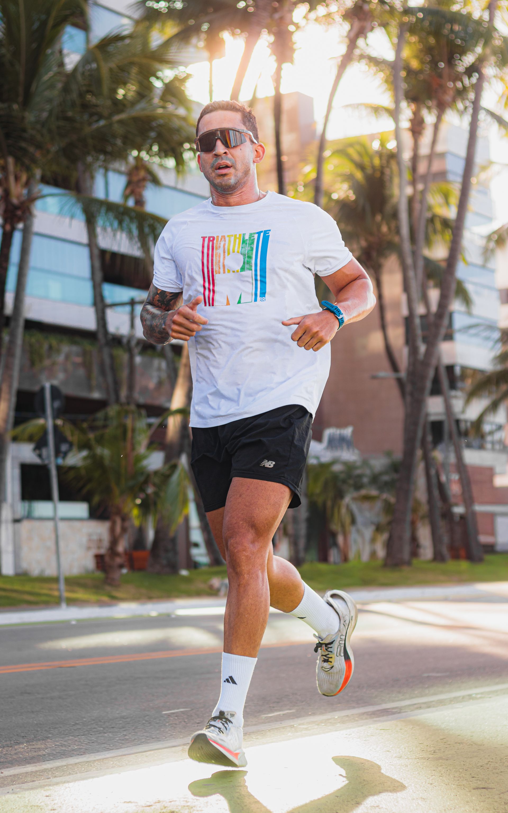 Runner training outdoors wearing a fitness smartwatch