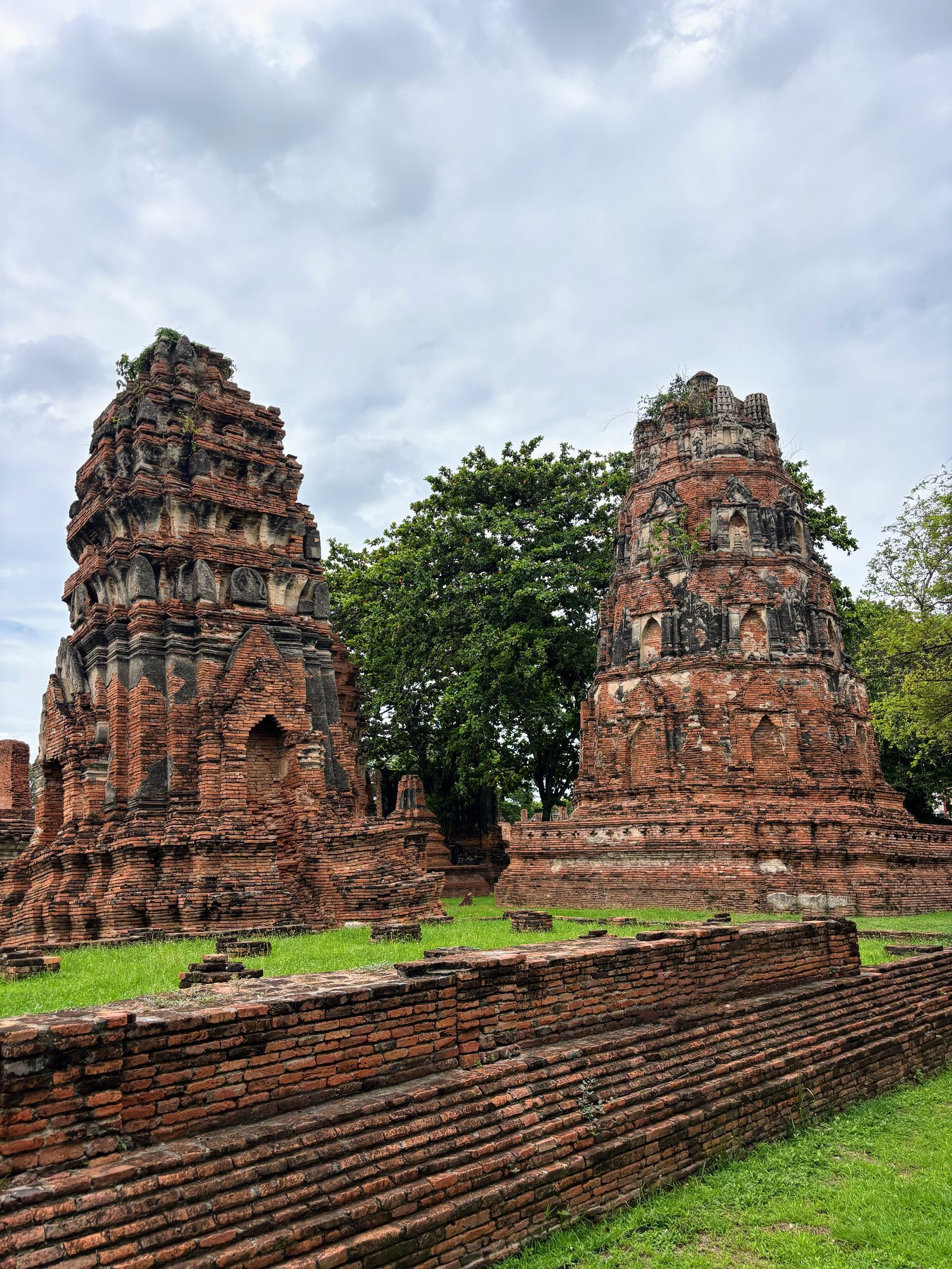 Weathered brick towers of temple ruins in Ayutthaya