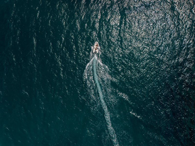 An Aerial Photography of a Motorboat Swerving on the Ocean · Free Stock ...