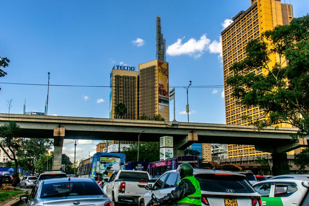 Busy central Nairobi street with shopfronts and pedestrians