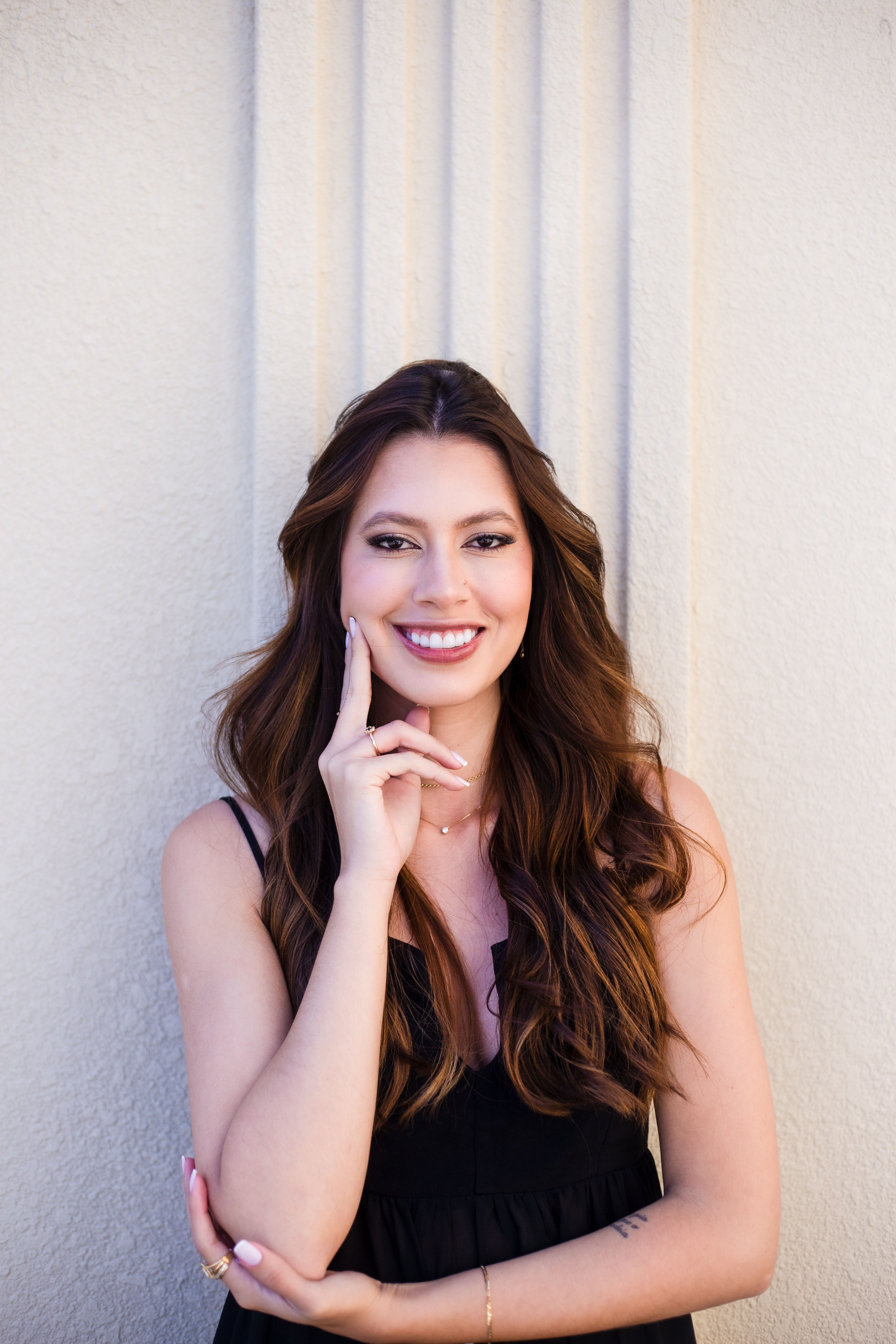 Smiling Woman with Long Hair Posing Outdoors · Free Stock Photo