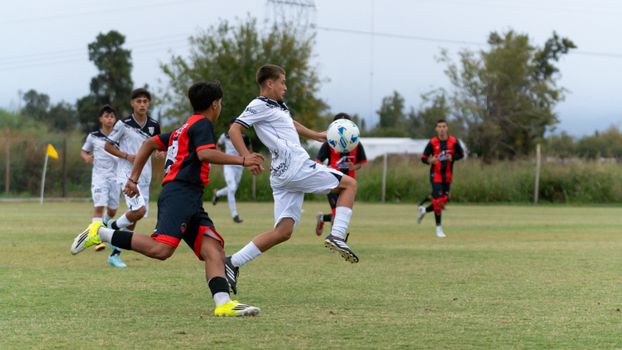 Action-packed youth soccer match on the field capturing player interactions and sportsmanship.