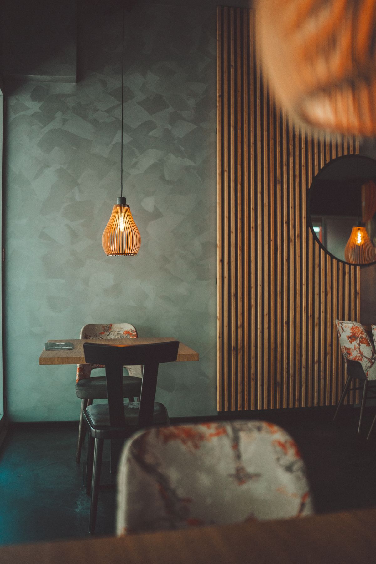 Main dining hall with warm pendant lighting