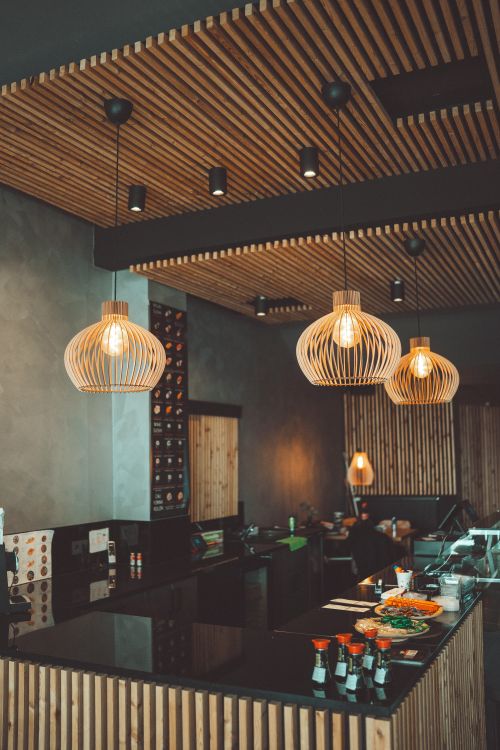 Free Modern Japanese restaurant interior with sushi and elegant lighting fixtures. Stock Photo