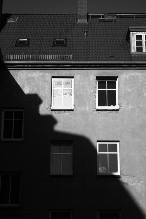 Free Monochrome image highlighting shadows on a Berlin building facade. Stock Photo