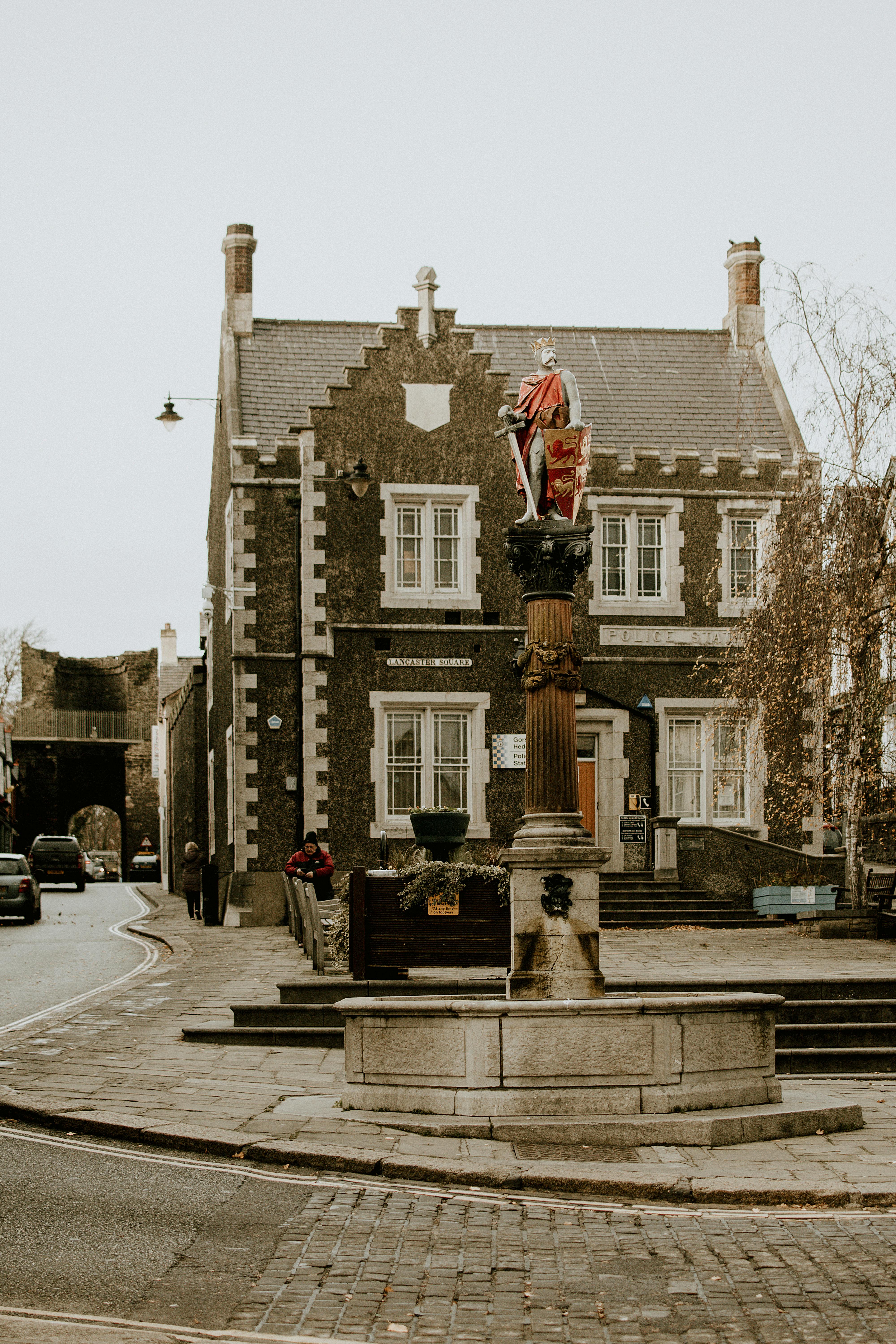Exterior view of old house in ornamental style located on street in gloomy day