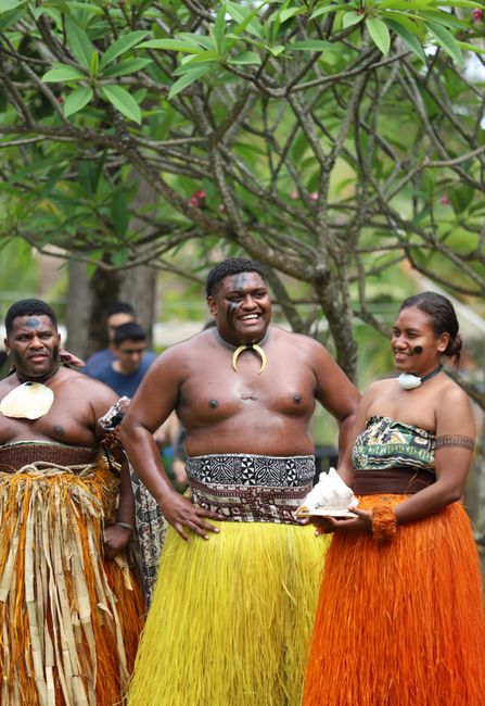 Photo by Benjamin Achrainer Hawaiian dancers performing in traditional clothing, showcasing vibrant cultural expressions.