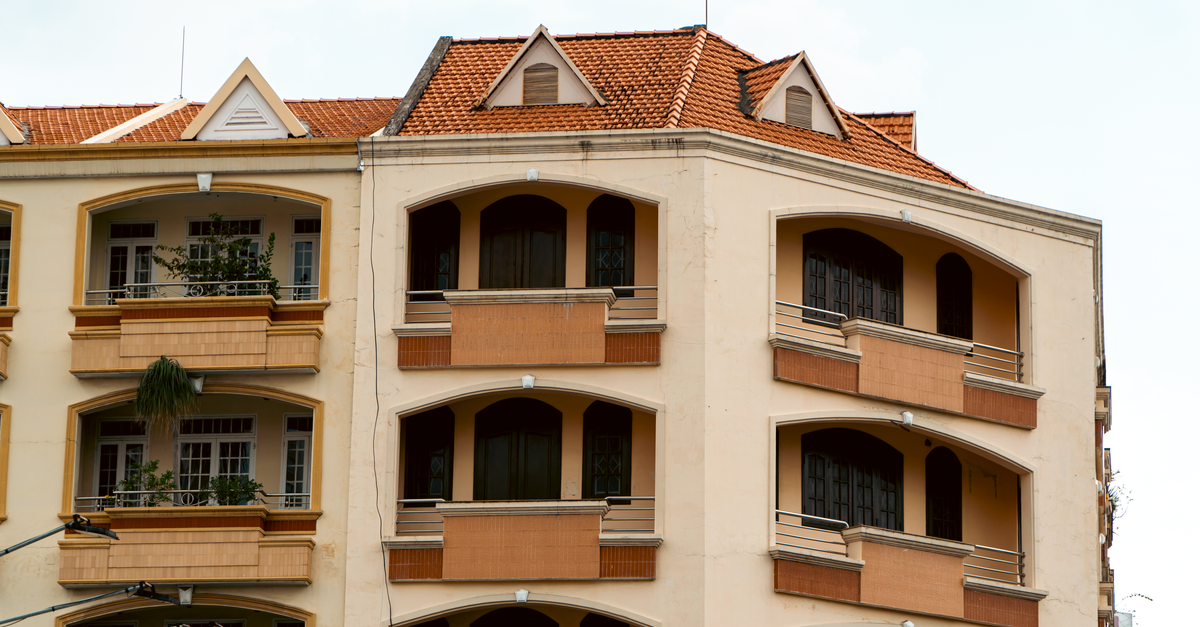 Distinctive architecture of an urban apartment building showcasing balconies.