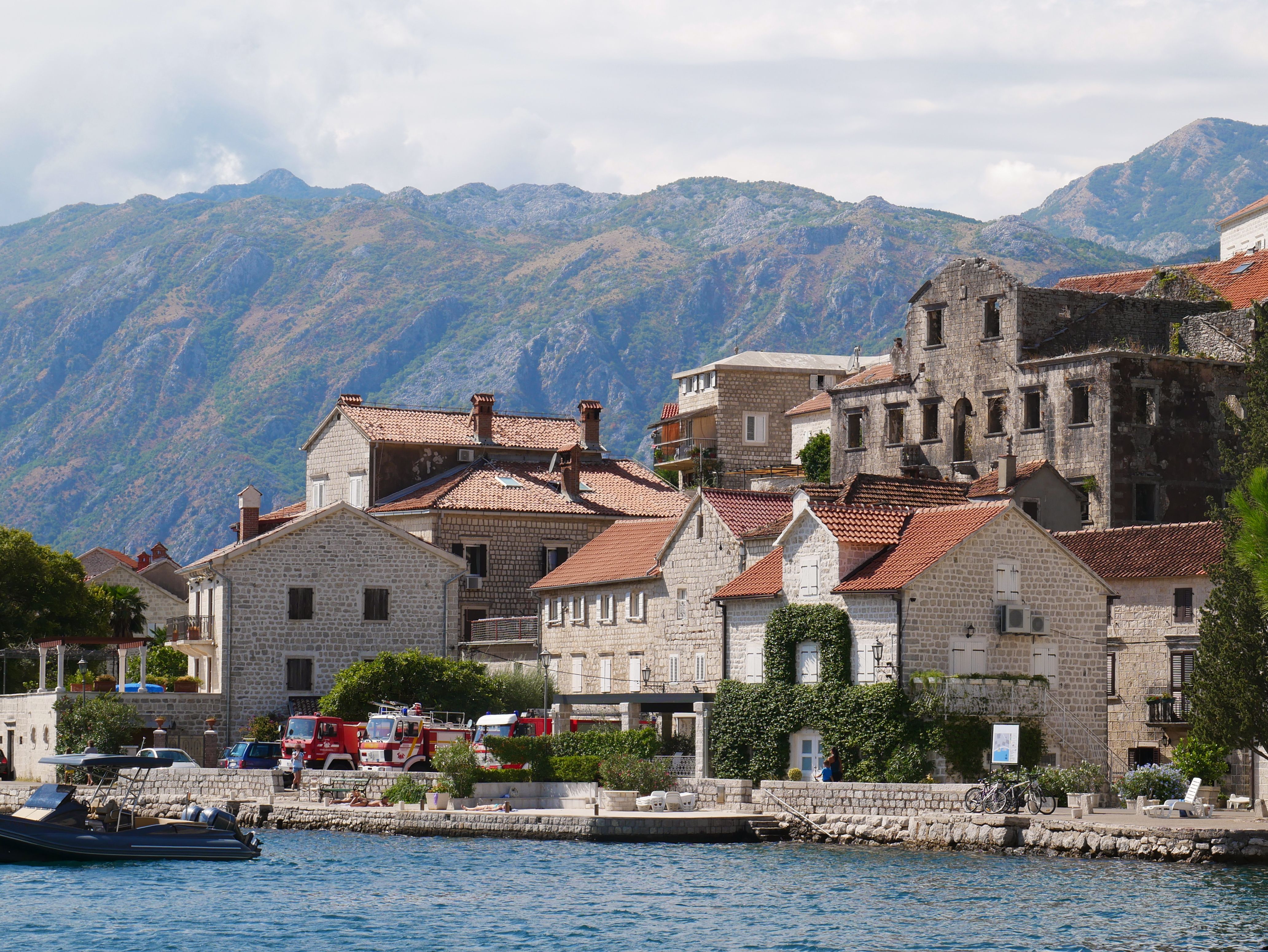 Exterior view of Tivat Airport in Montenegro with mountains in the background