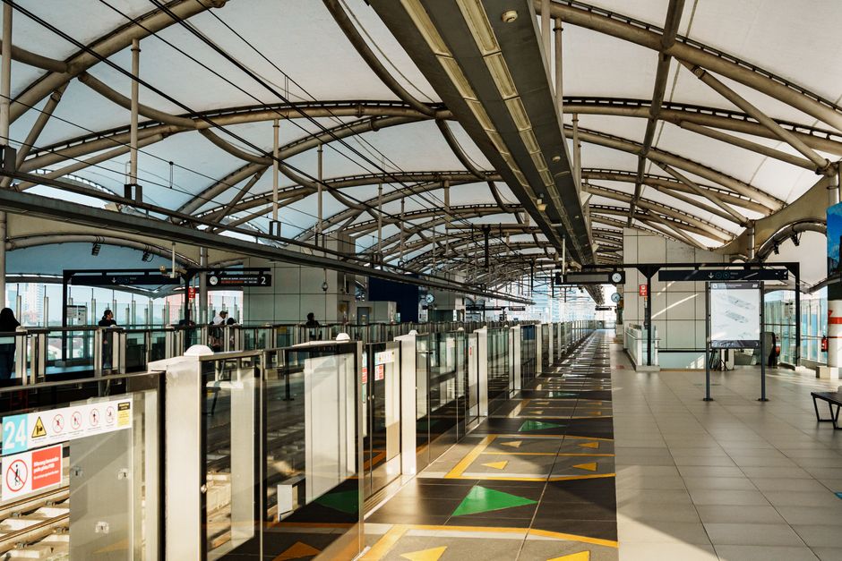 Modern Dubai Metro train arriving at a station
