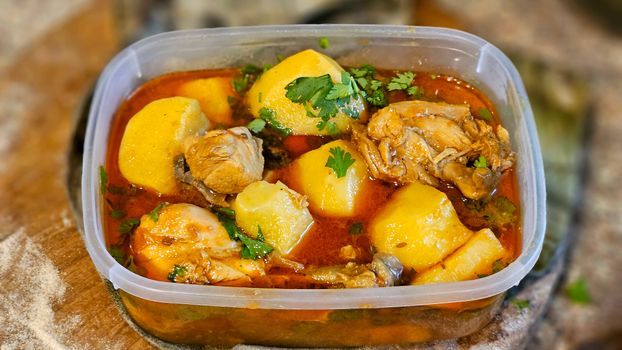 Appetizing chicken stew with potatoes and herbs, perfect for a hearty meal.