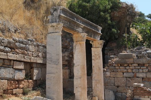 Stone columns and ancient walls in historic outdoor setting, perfect for history themes.